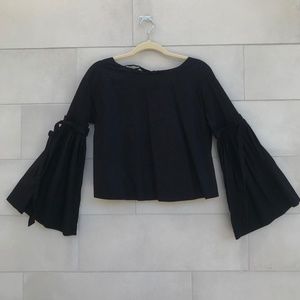 Black blouse with bell sleeve with draped details